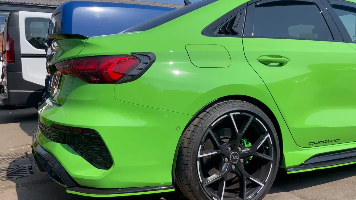 Audi RS3 rear quarter, black alloy and green brake caliper